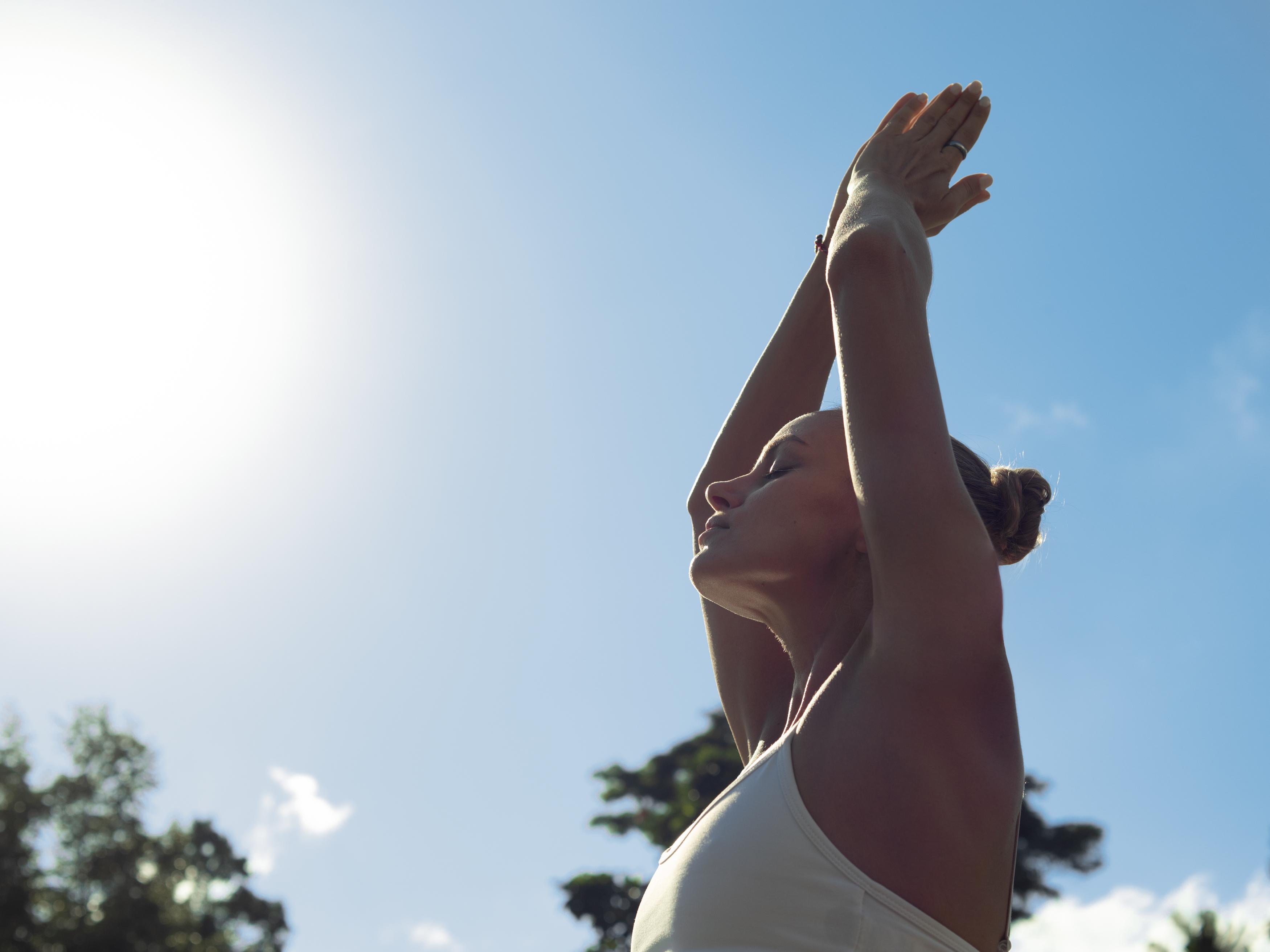 Hotel Adiwana Suweta Ubud Esterno foto A woman practicing yoga